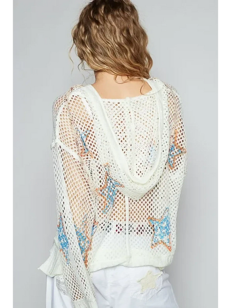 Back view of a white mesh long sleeve summer knit top with star patterns worn by a model
