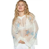 Babe Beachwear  white mesh long sleeve summer knit top with blue star patterns worn by woman