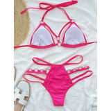 Beach Babes hot pink Miami style swimwear for women with strappy halter bikini top and multi-strap bottoms