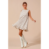 Trendsi sleeveless Mini Ruffle Dress with black pattern and ruffled hem paired with white boots
