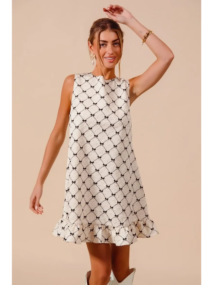 Trendsi sleeveless midi dress featuring a black and white pattern with ruffle hem Mini Ruffle Dress