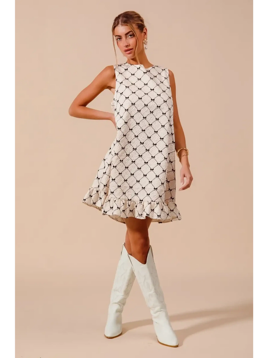 Trendsi Mini Ruffle Dress sleeveless midi dress with black diamond pattern and white knee-high boots