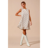 Trendsi Mini Ruffle Dress sleeveless midi dress with black diamond pattern and white knee-high boots