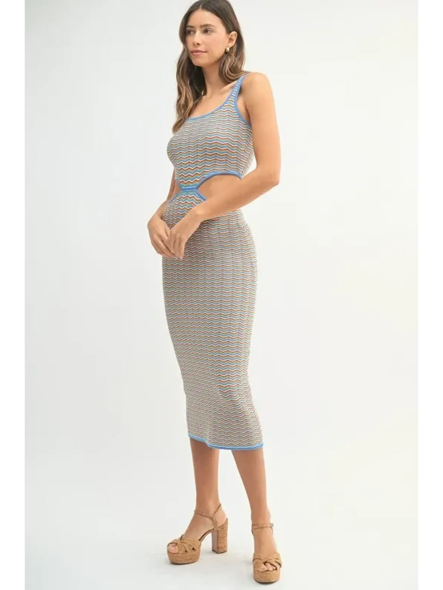 chevron knit bodycon midi dress with cutout detail and blue trim worn by model