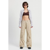 Woman wearing Emory Park relaxed cargo pants for women in beige with side pockets and a casual fit