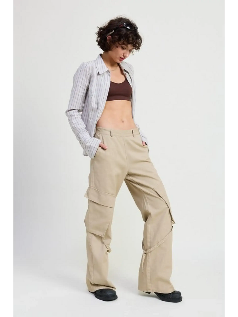 Woman wearing beige relaxed cargo pants for women with a striped shirt and dark crop top