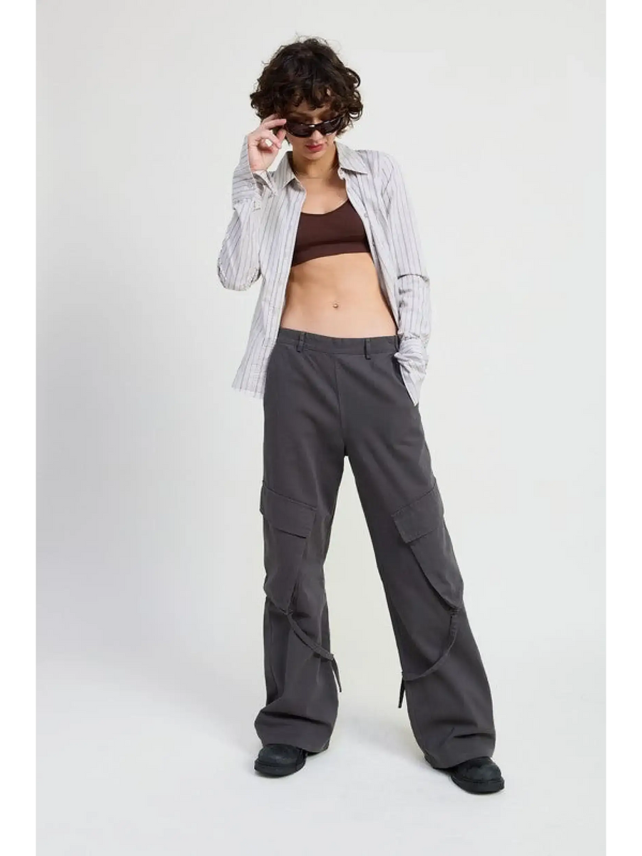 Woman wearing Emory Park relaxed cargo pants for women in gray with a striped shirt and sunglasses