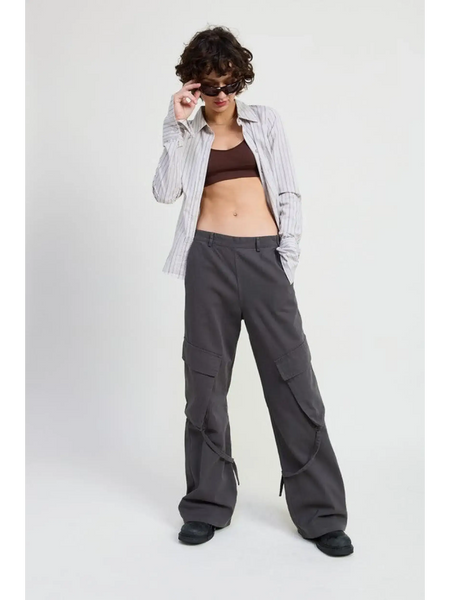 Woman wearing Emory Park relaxed cargo pants for women in gray with a striped shirt and sunglasses