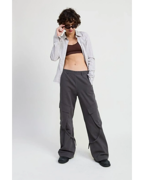 Woman wearing Emory Park relaxed cargo pants for women in gray with a striped shirt and sunglasses