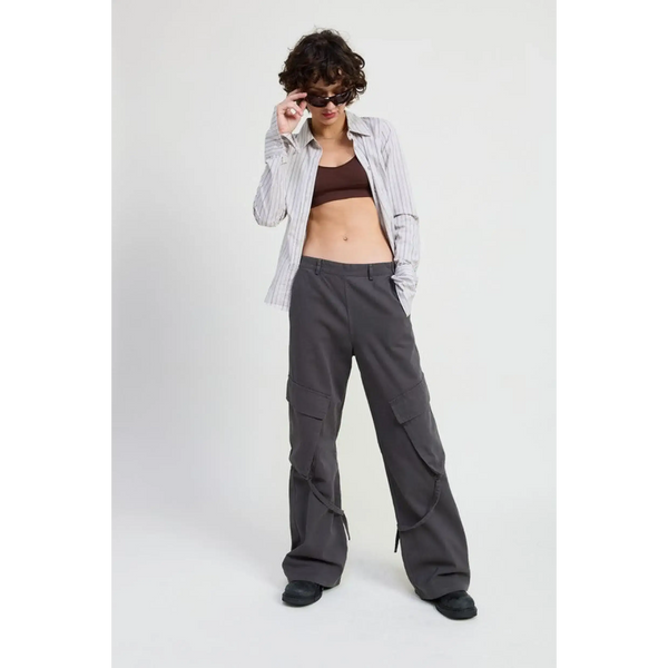 Woman wearing Emory Park relaxed cargo pants for women in gray with a striped shirt and sunglasses