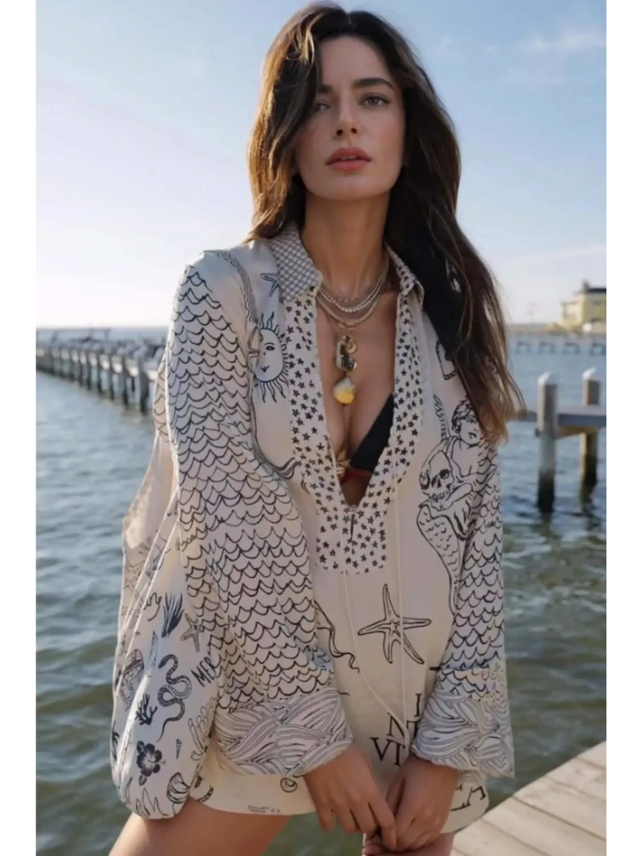 Trendsi Nautical Print Top and Shorts Set worn by woman standing by dock with ocean background