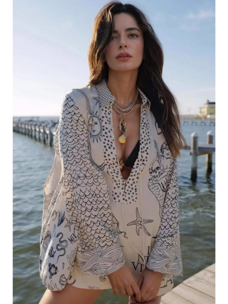 Trendsi Nautical Print Top and Shorts Set worn by woman standing by dock with ocean background