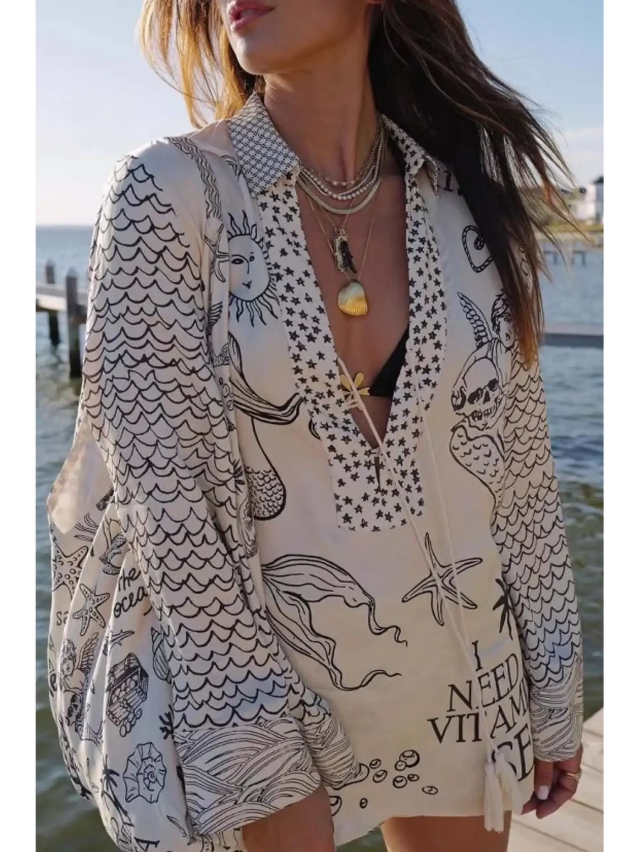 Nautical Print Top and Shorts Set by Trendsi featuring marine-themed patterns and relaxed fit perfect for beachwear