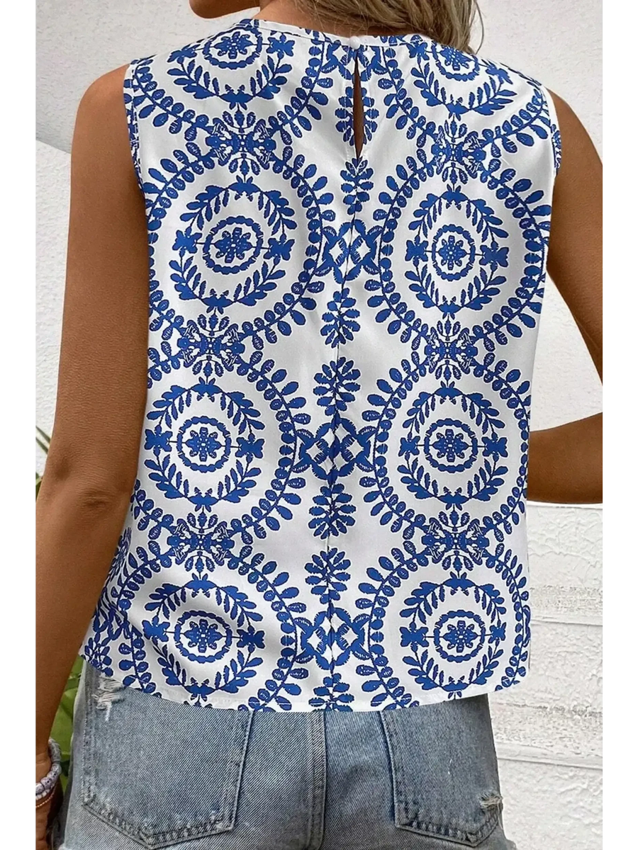 Trendsi navy blue sleeveless top for women with white background and intricate floral pattern