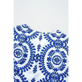 Navy blue sleeveless top for women with intricate floral embroidery on white fabric by Trendsi