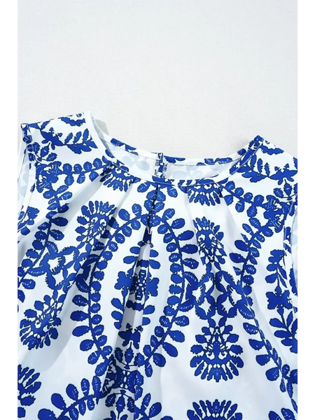 fabric Trendsi navy blue sleeveless top for women with white background and intricate floral pattern