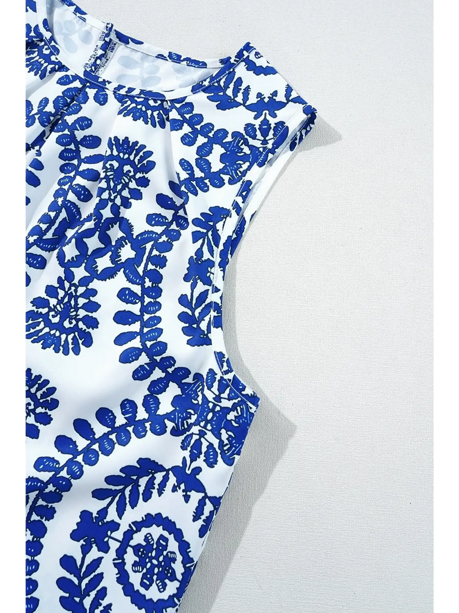 Trendsi navy blue sleeveless top for women with white background and floral pattern