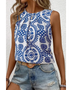 Trendsi navy blue sleeveless top for women with white floral pattern paired with denim shorts