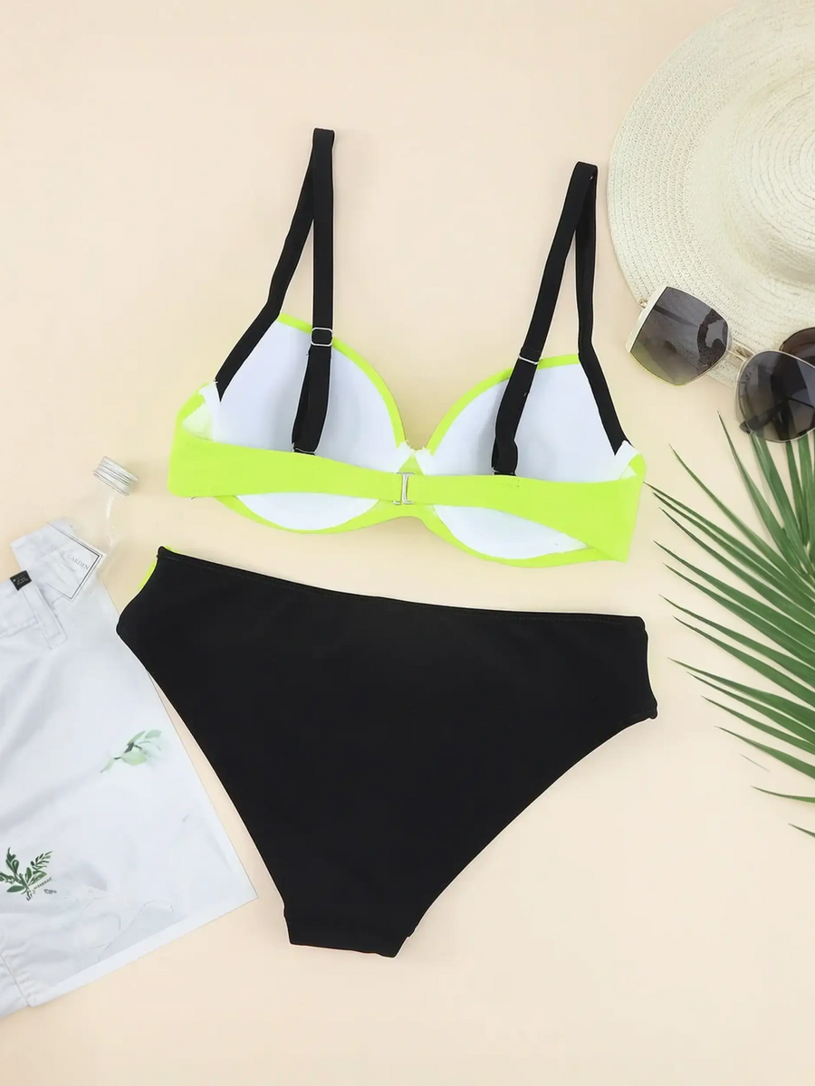 Trendsi neon bikini set with black bottoms and neon yellow top with black straps styled with white shorts hat and sunglasses