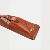 Brown crocodile pattern belt bag with buckle strap and gold Nicole Lee USA logo