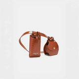 Babe Beachwear brown leather belt bag with two attached compartments and gold hardware
