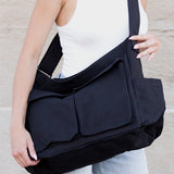Nova Oversized Canvas Messanger Bag by Babe Beachwaer in black worn crossbody on woman
