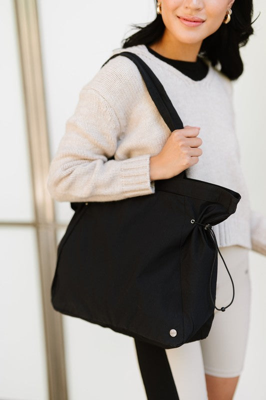 Babe Beachwear Nylon Lightweight Weekender Gym Bag in black carried on shoulder