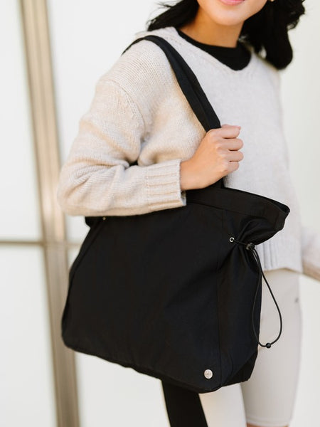 Babe Beachwear Nylon Lightweight Weekender Gym Bag in black carried on shoulder