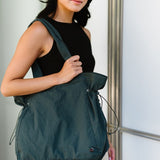 Nylon Lightweight Weekender Gym Bag by Babe Beachwaer carried by woman in casual outfit