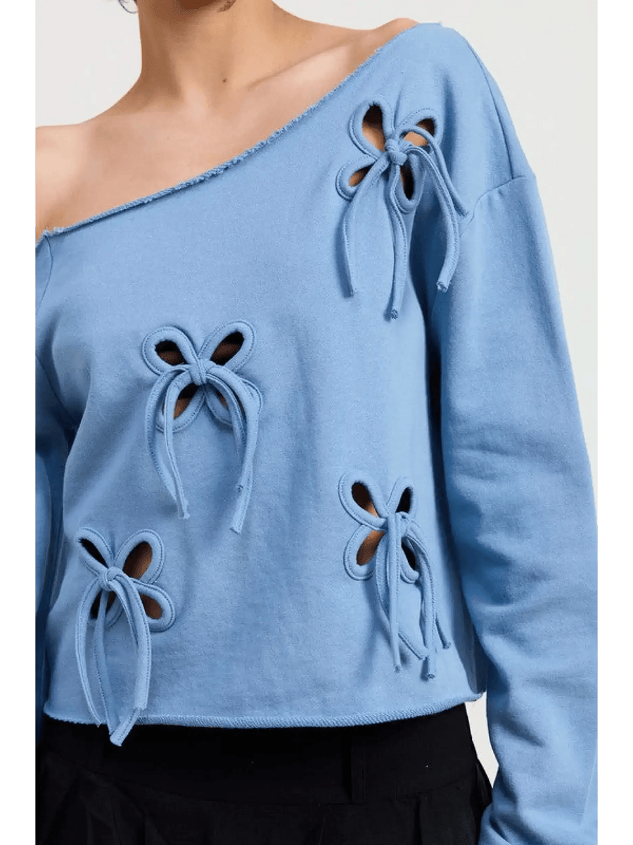 Emory Park Off Shoulder Distressed Top in blue with bow cutout details on a short sleeve