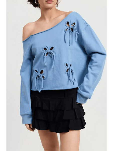 Emory Park off shoulder distressed top in blue with long sleeves and bow cutout details