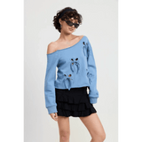 Emory Park Off Shoulder Distressed Top in light blue with long sleeves and bow details