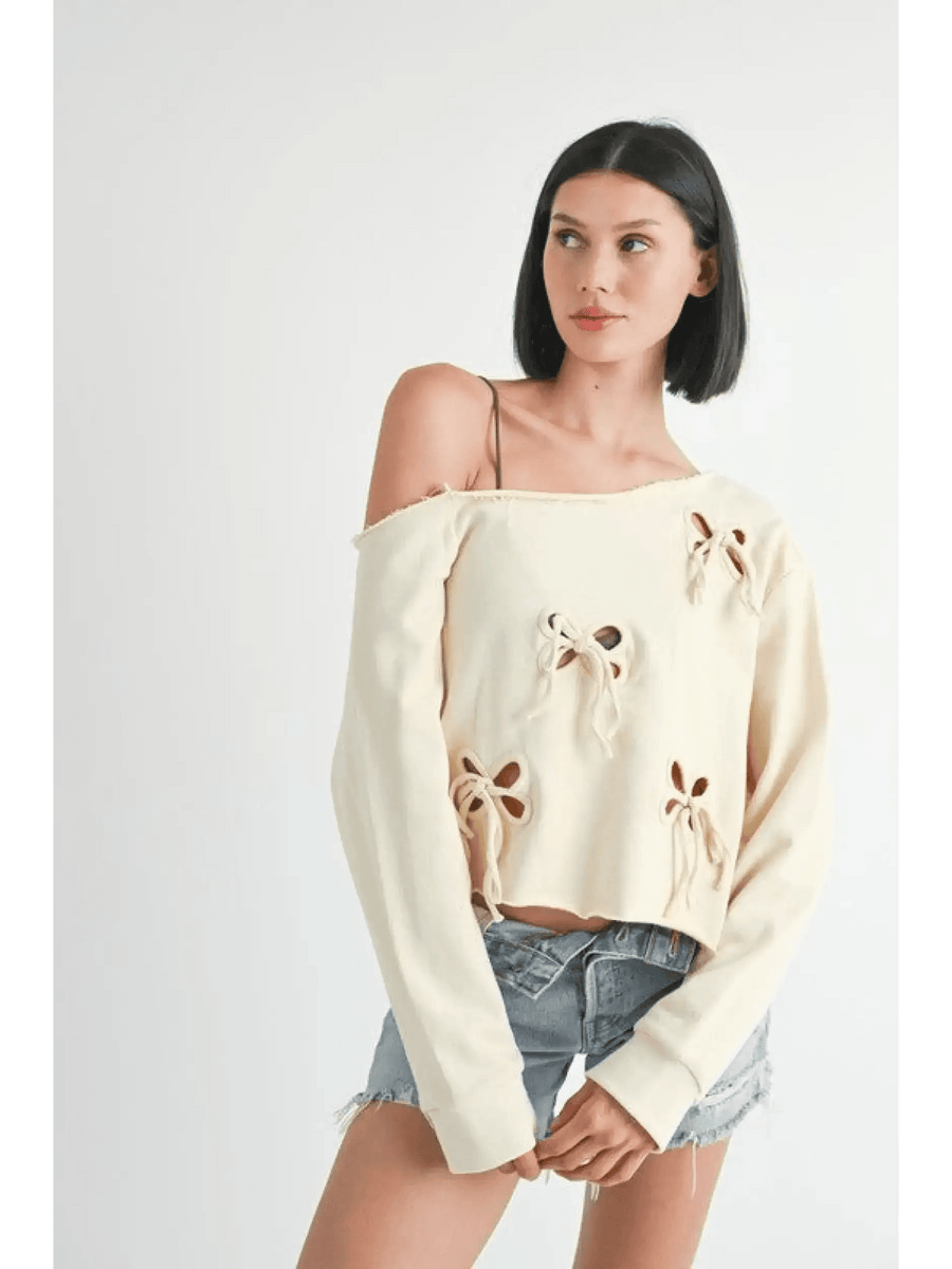 Emory Park Off Shoulder Distressed Top in cream with floral cutouts worn with denim shorts