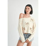 Emory Park Off Shoulder Distressed Top in cream with floral cutouts worn with denim shorts