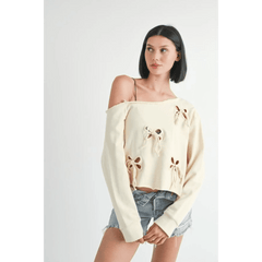 Emory Park Off Shoulder Distressed Top in cream with floral cutouts worn with denim shorts