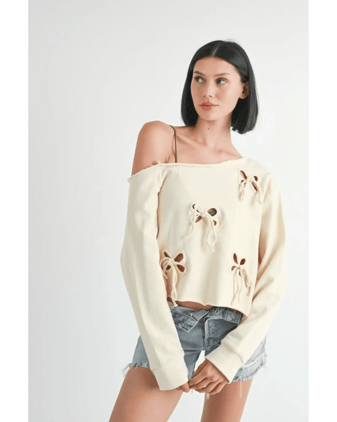 Emory Park Off Shoulder Distressed Top in cream with floral cutouts worn with denim shorts