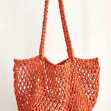 Miss Sparkling orange braided net beach tote with long braided handles for beach outings