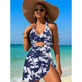 Beach Babes sexy cutout swim dress with palm tree print and halter neck on woman at the beach