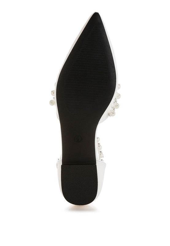 Bottom view of Rag Company pearl embellished summer sandals with a black sole and pointed toe