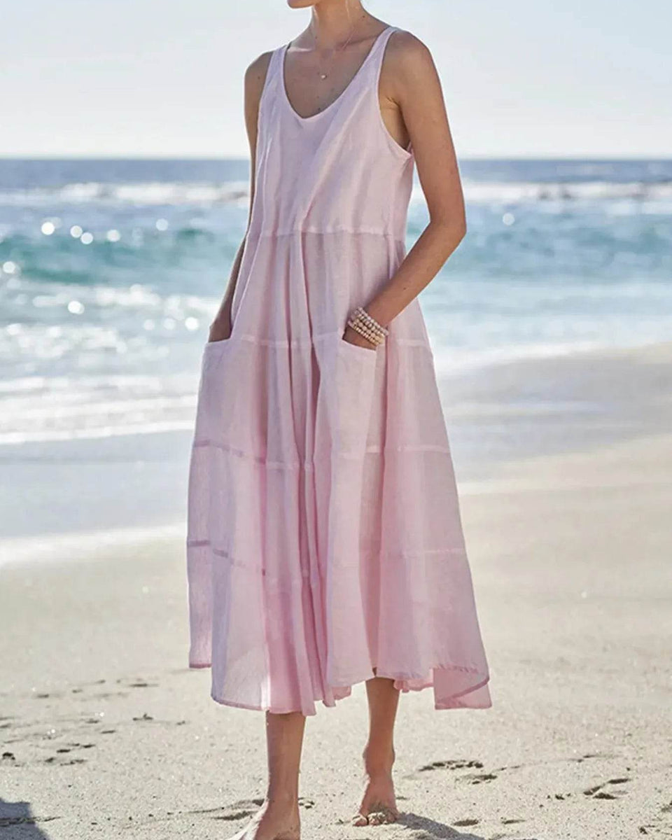 Babe Beachwear pink flowy sundress for women midi dress with pockets worn at the beach