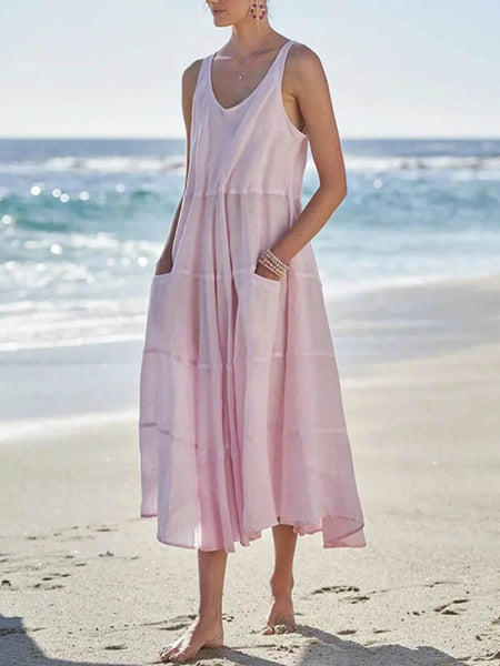 Babe Beachwear pink flowy sundress for women midi dress with pockets worn at the beach