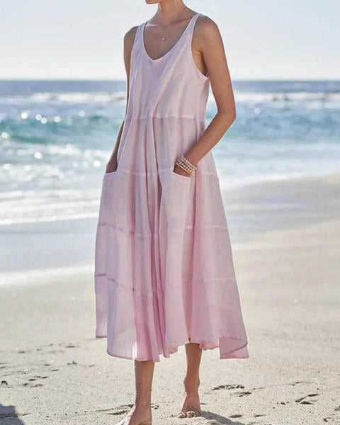 Babe Beachwear pink flowy sundress for women midi dress with pockets worn at the beach