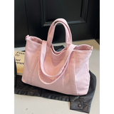 Babe Beachwaer pink lightweight Ladies duffle bag with dual handles on black jacket