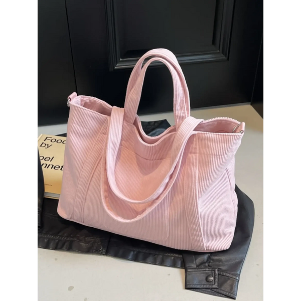 Babe Beachwaer pink lightweight Ladies duffle bag with dual handles on black jacket