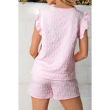 Back view of pink summer short set for women with bow pattern and ruffle sleeves