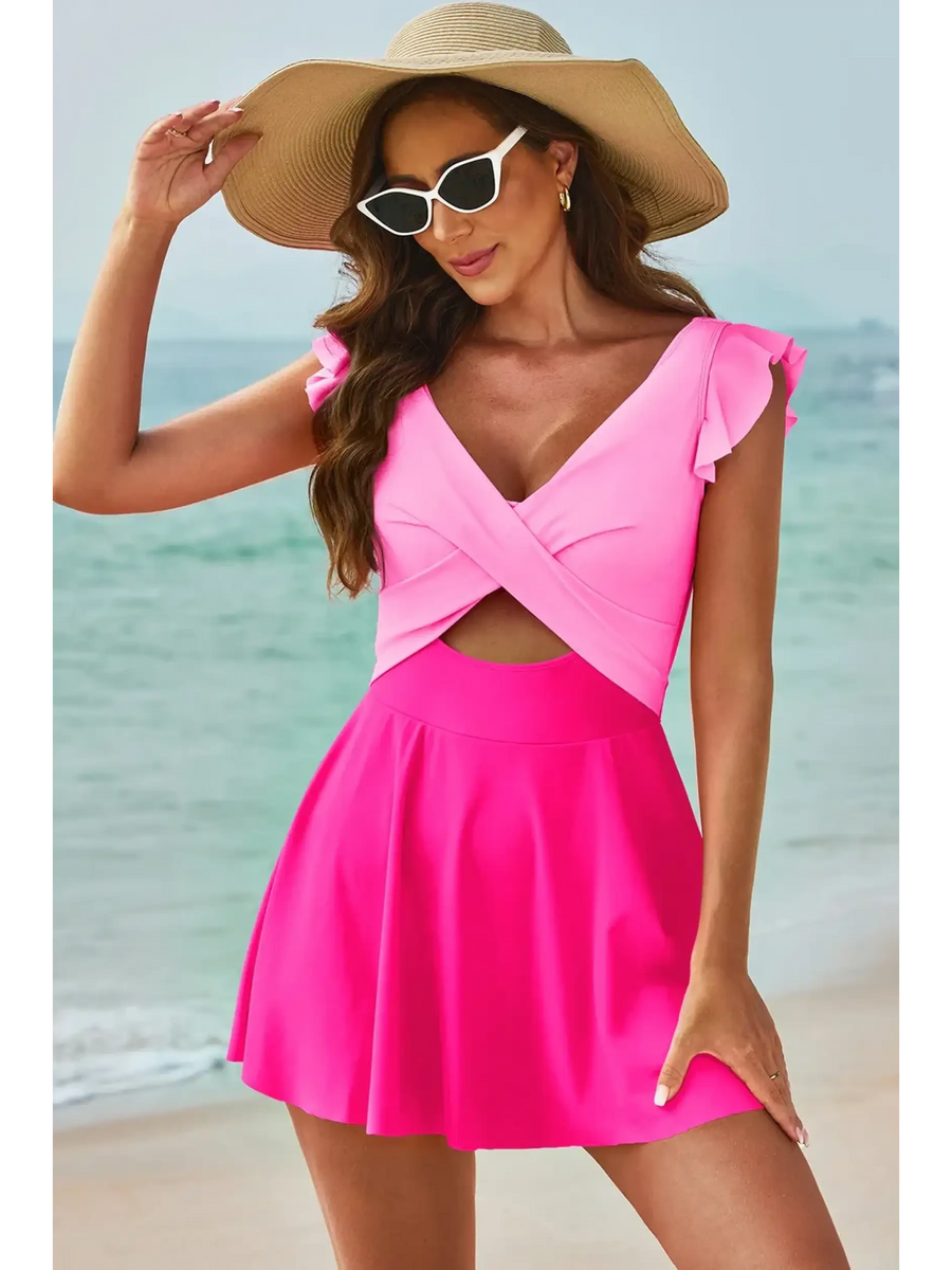 Beach Babes swimdress swimsuit with coverage and flowy skirt in pink on woman at the beach