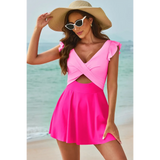 Beach Babes swimdress swimsuit with coverage and flowy skirt in pink on woman at the beach