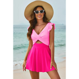 Beach Babes pink Swimdress Swimsuit with Coverage and Flowy Skirt worn by woman on the beach pink and coral 
