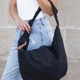 Babe Beachwaer Piper Oversized Nylon Carryall Bag for Travel in black carried on shoulder