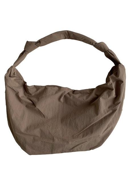 Piper Oversized Nylon Carryall Bag for Travel in taupe color with a knotted shoulder strap
